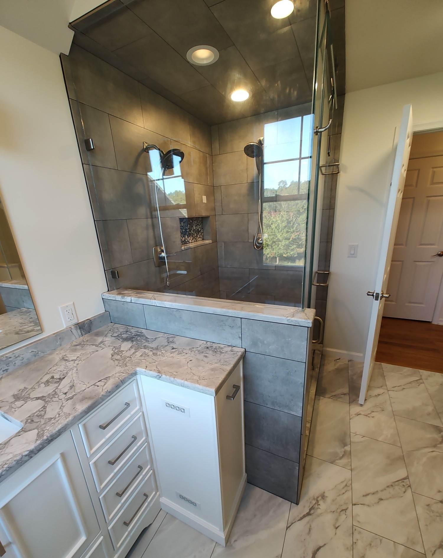 Full bathroom remodel with grey tile steam shower